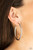 Hammered in blinding shimmer, a thick silver hoop curls around the ear for an edgy, urban look. Earring attaches to a standard post fitting. Hoop measures approximately 2" in diameter.

Sold as one pair of hoop earrings.