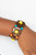 An oversized collection of multicolored beads and distressed brown wooden discs are threaded along stretchy bands that decoratively weave around the wrist for a summery flair.
Sold as one individual bracelet. An oversized collection of multicolored beads and distressed brown wooden discs are threaded along stretchy bands that decoratively weave around the wrist for a summery flair.
Sold as one individual bracelet.