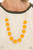 Vibrant geometric squares painted in the spring Pantone® of Marigold flare out along a long gold chain as it drapes along the chest. Sleek gold cylinders separate the square plates, adding warm metallic accents to the piece. Features an adjustable clasp closure.
Sold as one individual necklace. Includes one pair of matching earrings. Vibrant geometric squares painted in the spring Pantone® of Marigold flare out along a long gold chain as it drapes along the chest. Sleek gold cylinders separate the square plates, adding warm metallic accents to the piece. Features an adjustable clasp closure.
Sold as one individual necklace. Includes one pair of matching earrings.
