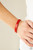 Metal rectangles painted in a fiery red finish are threaded along stretchy bands, forming a gorgeous pop of color that wraps around the wrist.

Sold as one individual bracelet.