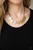 Hammered in a shimmery finish, asymmetrical oval frames and glistening gold beads alternate along a strip of brown suede below the collar, creating a bold fringe. Features an adjustable clasp closure.
Sold as one individual necklace. Includes one pair of matching earrings. Hammered in a shimmery finish, asymmetrical oval frames and glistening gold beads alternate along a strip of brown suede below the collar, creating a bold fringe. Features an adjustable clasp closure.
Sold as one individual necklace. Includes one pair of matching earrings.