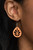 Painted in a colorful Marigold finish, a dainty orange leaf frame is stenciled in airy cutouts for a whimsical seasonal fashion. Earring attaches to a standard fishhook fitting.

Sold as one pair of earrings.