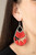 Three abstract silver fittings section off the inside of a pronged teardrop. Red thread is wrapped around the bar-like fittings, creating colorful loom-like accents. Earring attaches to a standard fishhook fitting.

Sold as one pair of earrings.