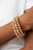 Sections of glistening gold beads and an alternating pattern of golden and iridescent flecked gems gradually increase in size along a coiled wire, creating a jaw-dropping infinity wrap bracelet around the wrist.

Sold as one individual bracelet.