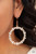 Encased in gold pronged fittings, an incandescent array of white marquise cut rhinestones delicately coalesce into a glowing hoop. Earring attaches to a standard fishhook fitting.

Sold as one pair of earrings.