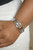 An oval Tiger's eye stone is pressed into the center of a studded silver frame atop an airy silver cuff embellished in studded sun-like frames for an earthy pop of seasonal color around the wrist.
Sold as one individual bracelet. An oval Tiger's eye stone is pressed into the center of a studded silver frame atop an airy silver cuff embellished in studded sun-like frames for an earthy pop of seasonal color around the wrist.
Sold as one individual bracelet.