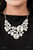 Featuring an oversized collection of round, oval, and teardrop white rhinestones, an exaggerated explosion of dynamite dazzle coalesces into three separate frames below the collar. The combustible frames flawlessly link into a mismatched arrangement of legendary sparkle. Features an adjustable clasp closure.

Named after the 2021 Seize the Spotlight winner, Danielle V.
Sold as one individual necklace. Includes one pair of matching earrings.