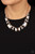 Encased in sleek rose gold fittings, an oversized collection of emerald cut white rhinestones link with rhinestone dotted teardrop rhinestone frames below the collar for a jaw-dropping display. Features an adjustable clasp closure.
Sold as one individual necklace. Includes one pair of matching earrings. Encased in sleek rose gold fittings, an oversized collection of emerald cut white rhinestones link with rhinestone dotted teardrop rhinestone frames below the collar for a jaw-dropping display. Features an adjustable clasp closure.
Sold as one individual necklace. Includes one pair of matching earrings.