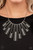 Elongated flared frames are painted in a glossy black finish and bordered by studded texture as they fan out along the collar. A row of rhinestones runs up the center of each frame, adding spectacular sparkle to the display as the pieces sway from a round silver chain. Features an adjustable clasp closure.

Sold as one individual necklace. Includes one pair of matching earrings.