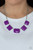 Varying in shape, faceted Amethyst Orchid acrylic frames delicately link below the collar, creating a vivacious display. Features an adjustable clasp closure.

Sold as one individual necklace. Includes one pair of matching earrings.
