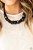Dainty black beads and sparkly white crystal-like beads cluster between oversized black beads that are threaded along an invisible wire below the collar, creating a stunning centerpiece. Features an adjustable clasp closure.
Sold as one individual necklace. Includes one pair of matching earrings. Dainty black beads and sparkly white crystal-like beads cluster between oversized black beads that are threaded along an invisible wire below the collar, creating a stunning centerpiece. Features an adjustable clasp closure.
Sold as one individual necklace. Includes one pair of matching earrings.