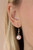 Sections of oversized silver chains, pink pearls, and shiny silver beads haphazardly link into two timeless layers below the collar, creating a dramatically refined display. Features an adjustable clasp closure.
Sold as one individual necklace. Includes one pair of matching earrings. Sections of oversized silver chains, pink pearls, and shiny silver beads haphazardly link into two timeless layers below the collar, creating a dramatically refined display. Features an adjustable clasp closure.
Sold as one individual necklace. Includes one pair of matching earrings.