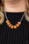 Dewy orange teardrop gems are nestled inside pronged silver frames that delicately connect below the collar, creating an ethereal centerpiece. Features an adjustable clasp closure.
Sold as one individual necklace. Includes one pair of matching earrings. Dewy orange teardrop gems are nestled inside pronged silver frames that delicately connect below the collar, creating an ethereal centerpiece. Features an adjustable clasp closure.
Sold as one individual necklace. Includes one pair of matching earrings.