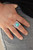 Chiseled into a tranquil square, a refreshing turquoise stone is pressed into the center of a square frame etched in linear patterns for a rustic finish. Features a stretchy band for a flexible fit.
Sold as one individual ring. Chiseled into a tranquil square, a refreshing turquoise stone is pressed into the center of a square frame etched in linear patterns for a rustic finish. Features a stretchy band for a flexible fit.
Sold as one individual ring.