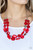 Varying in shape and opacity, faceted and smooth red glassy beads join textured silver discs and dainty silver beads along two dainty wires, layering into a flamboyant pop of color below the collar. Features an adjustable clasp closure.

Sold as one individual necklace. Includes one pair of matching earrings.