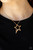 Infused with a dainty white rhinestone beaded accent, a striking gold star glides along a shiny gold chain below the collar, creating a stellar pendant. Features an adjustable clasp closure.
Sold as one individual necklace. Includes one pair of matching earrings. Infused with a dainty white rhinestone beaded accent, a striking gold star glides along a shiny gold chain below the collar, creating a stellar pendant. Features an adjustable clasp closure.
Sold as one individual necklace. Includes one pair of matching earrings.