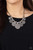 Embossed in metallically stitched patterns, silver discs gradually increase in size as they alternate with chunky silver beads along a round silver snake chain, creating a noise-making fringe below the collar. Features an adjustable clasp closure.
Sold as one individual necklace. Includes one pair of matching earrings. Embossed in metallically stitched patterns, silver discs gradually increase in size as they alternate with chunky silver beads along a round silver snake chain, creating a noise-making fringe below the collar. Features an adjustable clasp closure.
Sold as one individual necklace. Includes one pair of matching earrings.