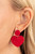 Painted in a glossy red finish, a hammered disc gives way to a hammered heart frame for a flirtatious fashion. Earring attaches to a standard post fitting.
Sold as one pair of post earrings. Painted in a glossy red finish, a hammered disc gives way to a hammered heart frame for a flirtatious fashion. Earring attaches to a standard post fitting.
Sold as one pair of post earrings.