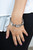 Featuring edgy chain-like fittings, a sparkly series of oversized white rhinestones are threaded along stretchy bands around the wrist for a dramatic pop of glitz.
Sold as one individual bracelet. Featuring edgy chain-like fittings, a sparkly series of oversized white rhinestones are threaded along stretchy bands around the wrist for a dramatic pop of glitz.
Sold as one individual bracelet.