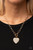 A blinding white rhinestone dotted gold heart frame sparkles from a toggle closure at the center of an oval gold linked chain for a flirtatious fashion. Features a toggle closure.
Sold as one individual necklace. Includes one pair of matching earrings. A blinding white rhinestone dotted gold heart frame sparkles from a toggle closure at the center of an oval gold linked chain for a flirtatious fashion. Features a toggle closure.
Sold as one individual necklace. Includes one pair of matching earrings.