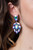 A stellar collection of marquise cut iridescent rhinestones nestle around an oversized teardrop iridescent rhinestone, creating a dramatically stellar display at the bottom of a matching oil spill teardrop rhinestone. Earring attaches to a standard post fitting.
Sold as one pair of post earrings. A stellar collection of marquise cut iridescent rhinestones nestle around an oversized teardrop iridescent rhinestone, creating a dramatically stellar display at the bottom of a matching oil spill teardrop rhinestone. Earring attaches to a standard post fitting.
Sold as one pair of post earrings.