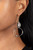 An imperfect crystal-like gem gives way to a twisted shiny silver hoop, resulting in a refined asymmetrical display. Earring attaches to a standard fishhook fitting.

Sold as one pair of earrings.