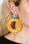 A hammered silver disc gives way to an oversized metal hoop wrapped in golden yellow thread, resulting in a modern lure. Earring attaches to a standard post fitting.
Sold as one pair of post earrings. A hammered silver disc gives way to an oversized metal hoop wrapped in golden yellow thread, resulting in a modern lure. Earring attaches to a standard post fitting.
Sold as one pair of post earrings.