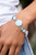 A rectangular sparkling blue gem and a milky blue oval bead add elegance to a monochromatic collection of three oversized pastel blue circles. Set in silver frames, the whimsical collection attaches to a silver chain, for a refreshing splash of color around the wrist. Features an adjustable clasp closure.
Sold as one individual bracelet. A rectangular sparkling blue gem and a milky blue oval bead add elegance to a monochromatic collection of three oversized pastel blue circles. Set in silver frames, the whimsical collection attaches to a silver chain, for a refreshing splash of color around the wrist. Features an adjustable clasp closure.
Sold as one individual bracelet.