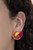 Featuring airy stenciled linear patterns, overlapping pink and orange crescent shaped frames gather around a dainty yellow crescent frame, creating a modern display. Earring attaches to a standard post fitting.

Sold as one pair of post earrings.