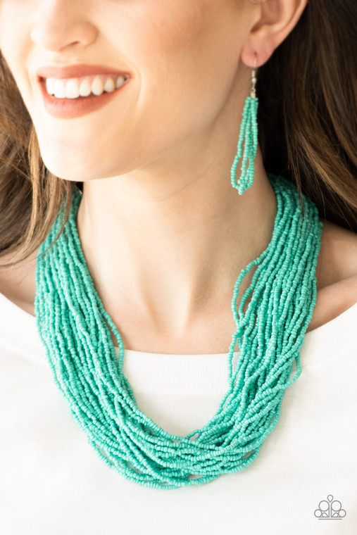 Infused with two bold silver fittings, countless strands of turquoise seed beads drape below the collar for a seasonal look. Features an adjustable clasp closure.

Sold as one individual necklace. Includes one pair of matching earrings.