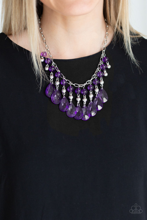 Faceted crystal-like teardrops in a gorgeous purple hue dance along the neckline with shiny silver beads and smaller purple crystal-like beads creating dramatic flair. Features an adjustable clasp closure.

Sold as one individual necklace. Includes one pair of matching earrings.