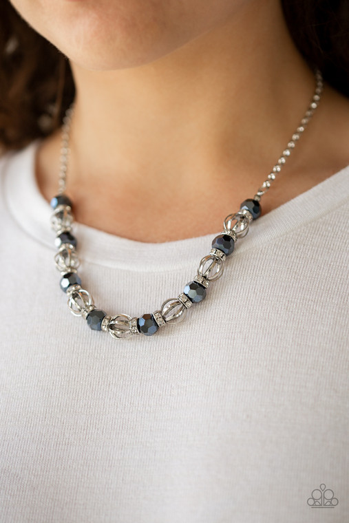 A collection of airy silver beads, faceted blue metallic beads, and white rhinestone encrusted rings are threaded along an invisible wire below the collar for a statement-making fashion. Features an adjustable clasp closure.

Sold as one individual necklace. Includes one pair of matching earrings.