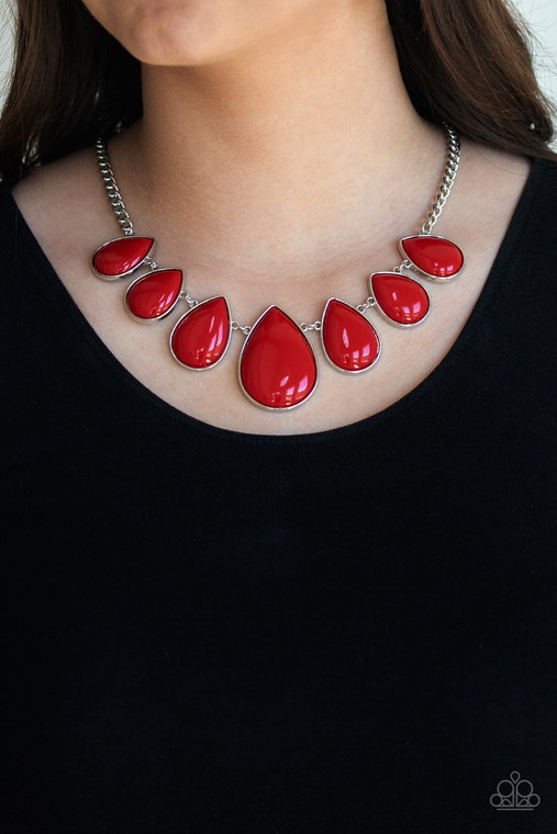 Gradually increasing in size near the center, shiny red teardrop beaded frames link below the collar for a vivacious look. Features an adjustable clasp closure.

Sold as one individual necklace. Includes one pair of matching earrings.