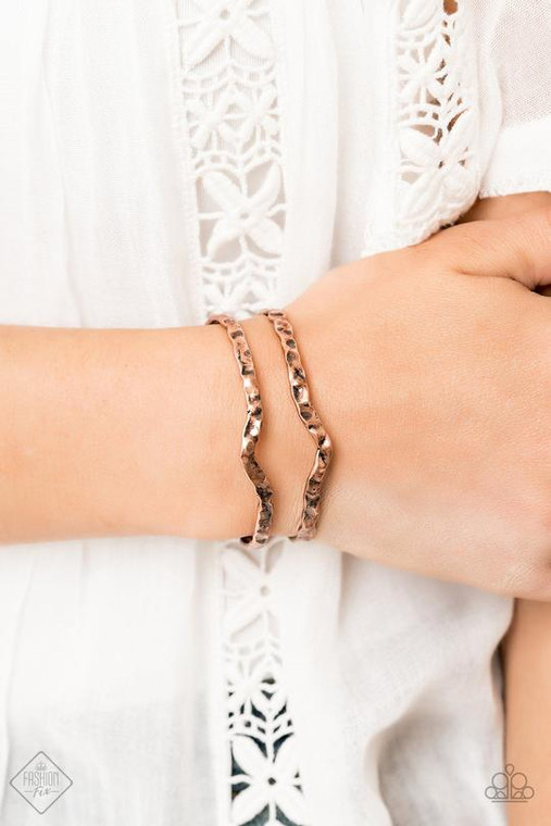 Delicately hammered in antiqued shimmer, glistening copper bars arc across the wrist, coalescing into an airy cuff.

Sold as one individual bracelet.
