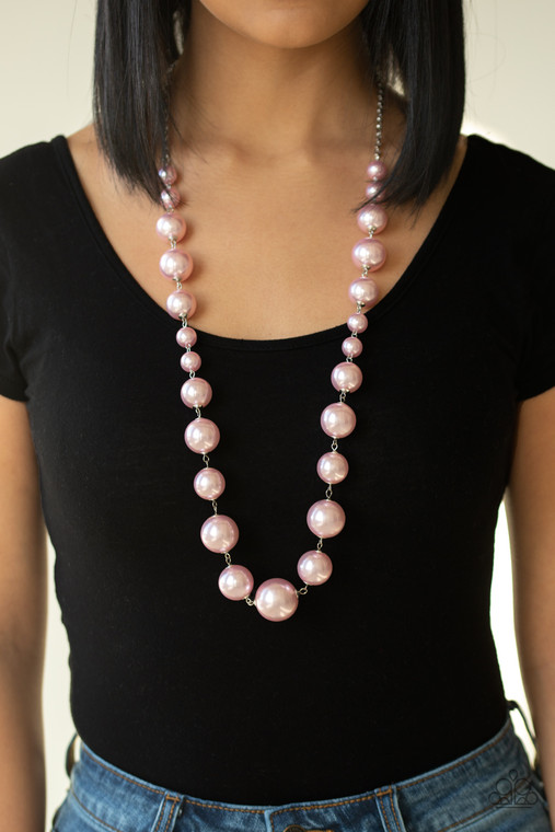 Infused with dainty pink pearls, a bubbly collection of oversized pink pearls link across the chest for a timeless finish. Features an adjustable clasp closure.

Sold as one individual necklace. Includes one pair of matching earrings.