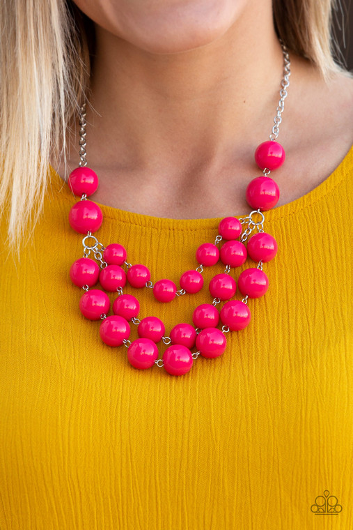 Three strands of bubbly pink beads cascade below the collar, creating colorful layers. Features an adjustable clasp.

Sold as one individual necklace. Includes one pair of matching earrings.