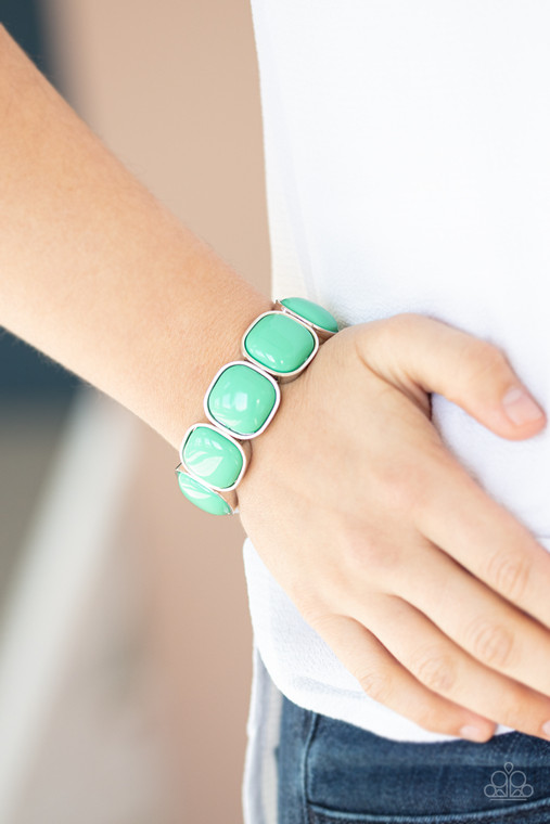 Minty Biscay Green beads are pressed into sleek silver fittings that slide along stretchy bands around the wrist, creating a vivacious pop of color.

Sold as one individual bracelet.