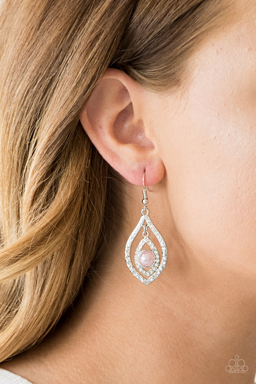 Delicately hammered in endless shimmer, a glistening marquise shaped frame swings from the top of a larger silver frame, creating an elegant lure. Featuring a pearly pink center, the smaller frame has been dipped into glassy white rhinestones for a glamorous finish. Earring attaches to a standard fishhook fitting.

Sold as one pair of earrings.