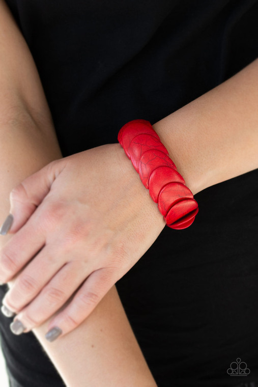 Overlapping red stones are threaded along stretchy bands around the wrist for an artisan inspired look.

Sold as one individual bracelet.