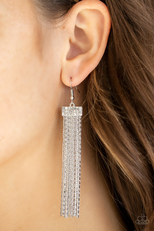 Dainty flat silver chains stream from the bottom of a rectangular silver frame stacked with rows of glittery white rhinestones, creating a shimmery tassel. Earring attaches to a standard fishhook fitting.

Sold as one pair of earrings.