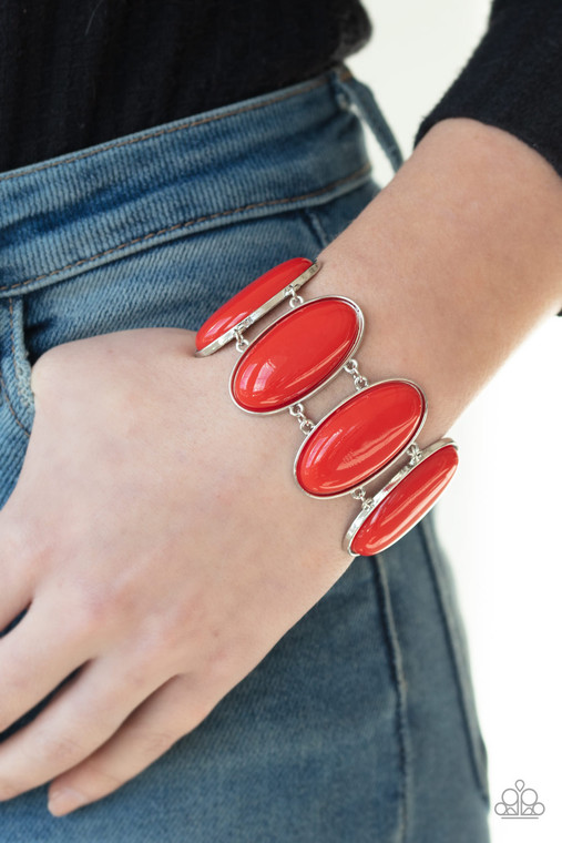 Dotted with oblong red beaded centers, vibrant silver frames link around the wrist for a powerful pop of color. Features an adjustable clasp closure.

Sold as one individual bracelet.