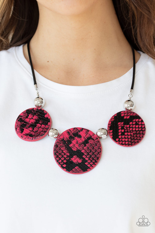 A wild collection of oversized silver beads and black and pink python patterned leather pieces are strung along an invisible wire below the collar for statement-making finish. Features an adjustable clasp closure.

Sold as one individual necklace. Includes one pair of matching earrings.