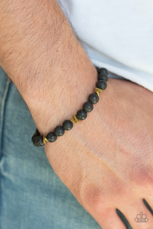 An earthy collection of brassy metallic accents and black lava beads are threaded along a stretchy band around the wrist for a seasonal look.

Sold as one individual bracelet.