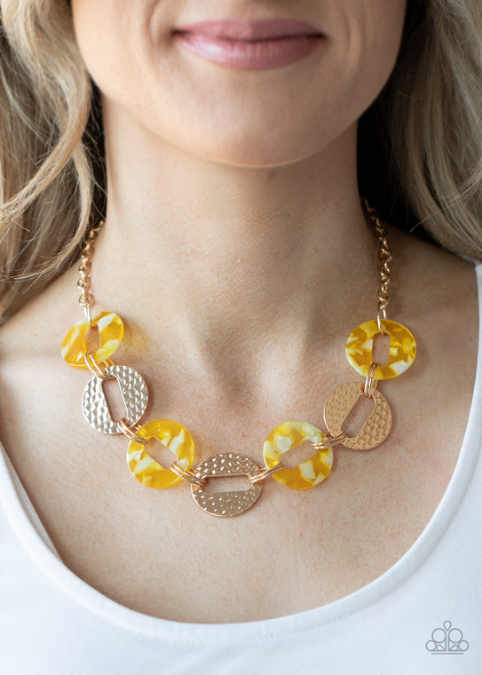 Featuring airy circular shapes, hammered gold frames link with shiny yellow acrylic frames below the collar for a colorfully retro look. Features an adjustable clasp closure.

Sold as one individual necklace. Includes one pair of matching earrings.