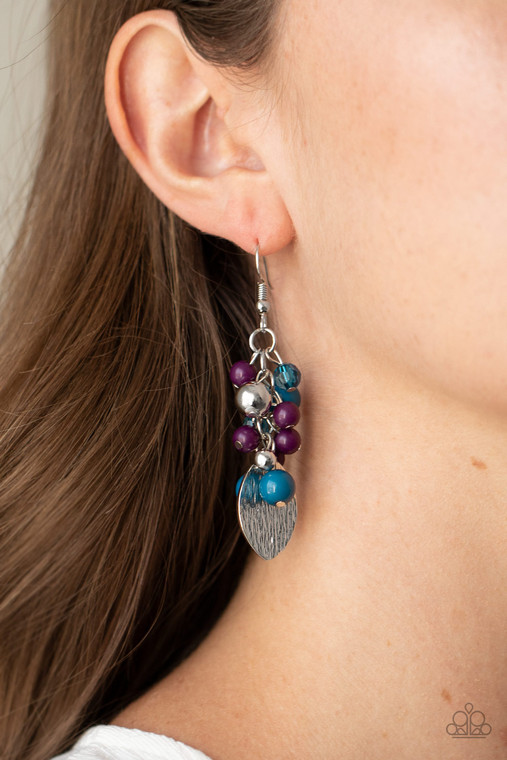 A textured silver piece dangles from the bottom of a clustered fringe of bubbly plum, blue, and shiny silver beads, creating a vivacious lure. Earring attaches to a standard fishhook fitting.

Sold as one pair of earrings.