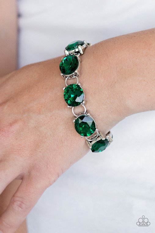 Featuring sleek silver settings, a blinding collection of oversized green rhinestones dramatically link across the wrist for a glamorous fashion. Features an adjustable clasp closure.

Sold as one individual bracelet.