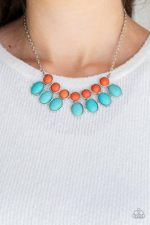 Round orange stone beads connect to oval turquoise stone beads, creating an earthy fringe below the collar for a seasonal look. Features an adjustable clasp closure.
Sold as one individual necklace. Includes one pair of matching earrings.