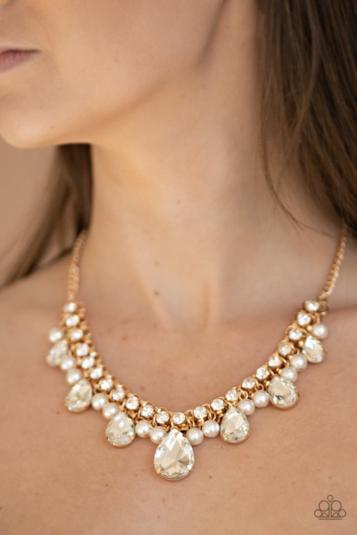 A glamorous collection of bubbly white pearls and exaggerated white teardrop gems dangle from a bold strand of white rhinestones, creating a knockout fringe below the collar. Features an adjustable clasp closure.

Sold as one individual necklace. Includes one pair of matching earrings.