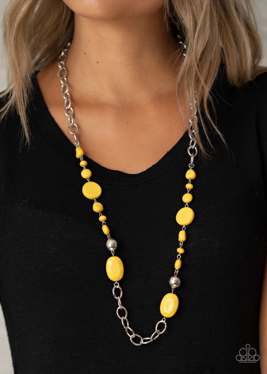 Varying in size and shape, flat and faceted yellow beads link with a pair of classic silver beads along sections of bold silver links, coalescing into a colorful display across the chest. Features an adjustable clasp closure.

Sold as one individual necklace. Includes one pair of matching earrings.