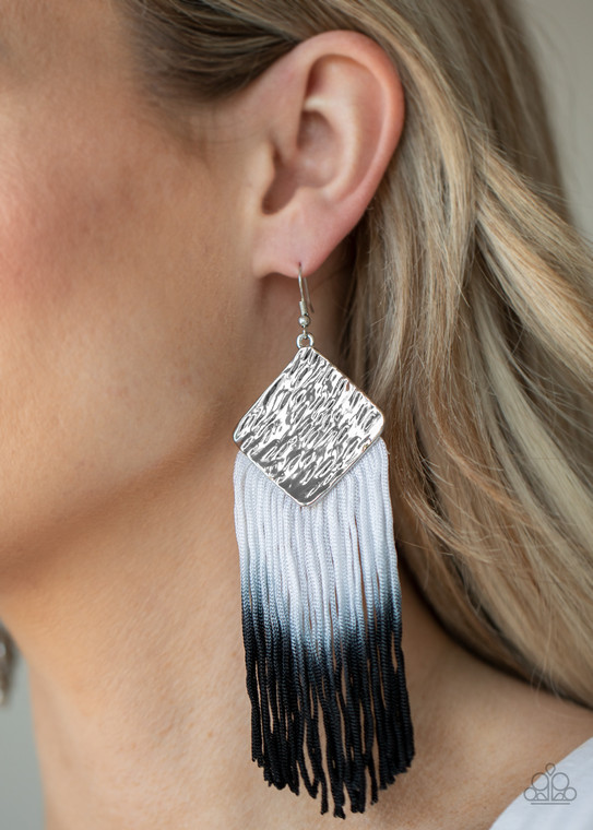 Fading from white to black, shiny thread dances from the bottom of a hammered silver frame, creating a flirtatious fringe. Earring attaches to a standard fishhook fitting.

Sold as one pair of earrings.